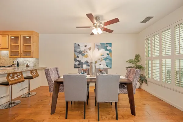a view of a dining room with furniture window and wooden floor