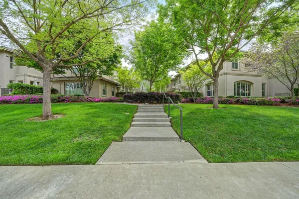 a front view of a house with garden