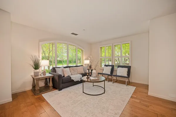 a living room with furniture and a large window