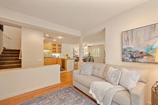 a view of a living room kitchen and a wooden floor