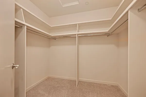 a view of an empty walk in closet