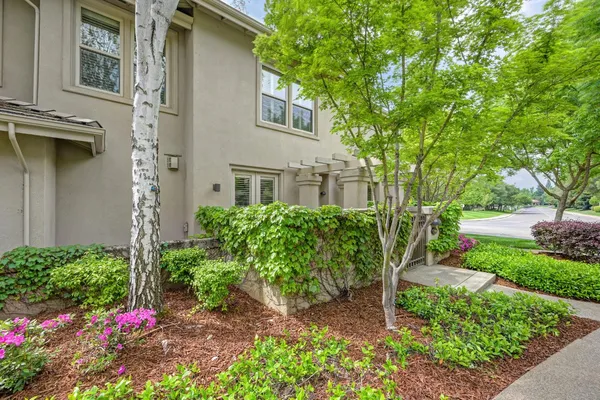 a view of a pathway in front of house