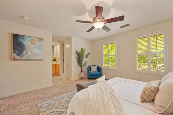 a bedroom with bed and window