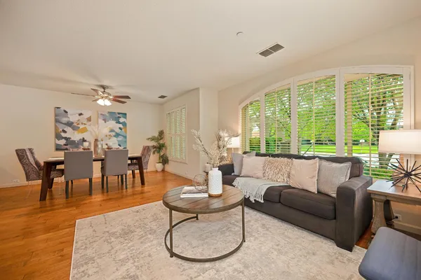 a living room with furniture and a large window