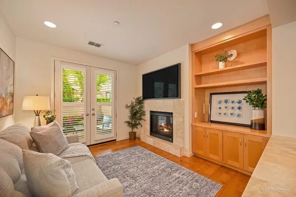 a living room with furniture and a fireplace