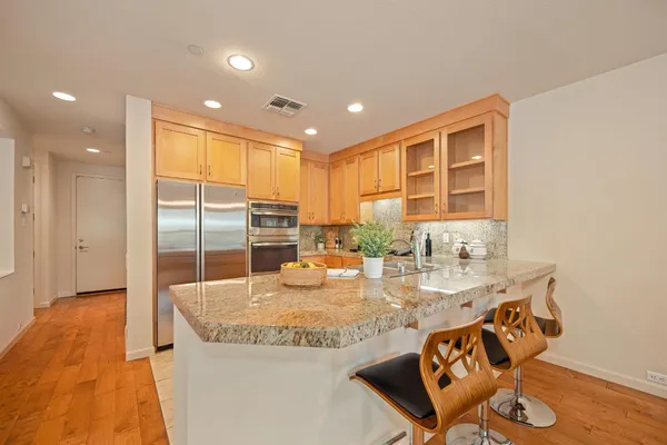 a kitchen with granite countertop sink and granite counter top