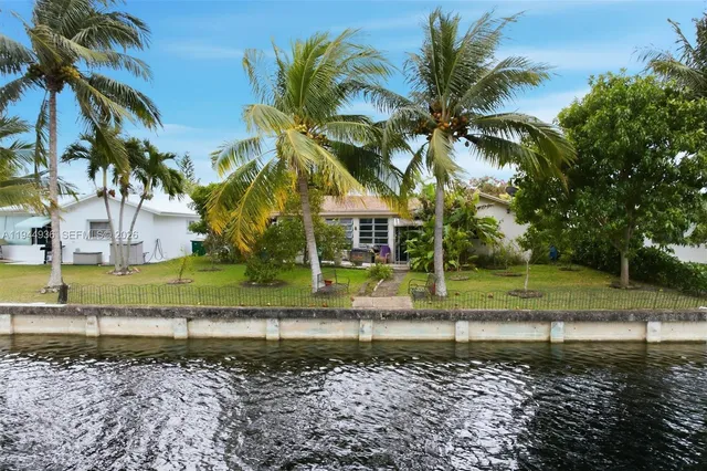 a view of a yard with swimming pool