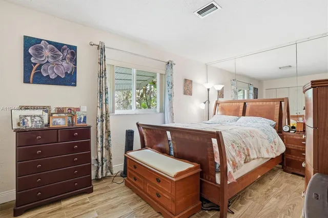 a bedroom with a bed and a dresser