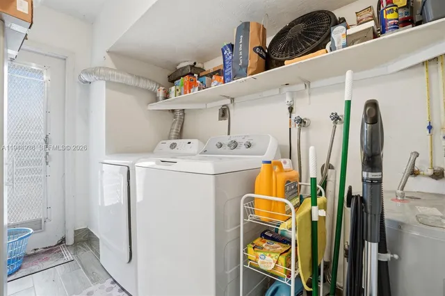 a utility room with dryer and washer