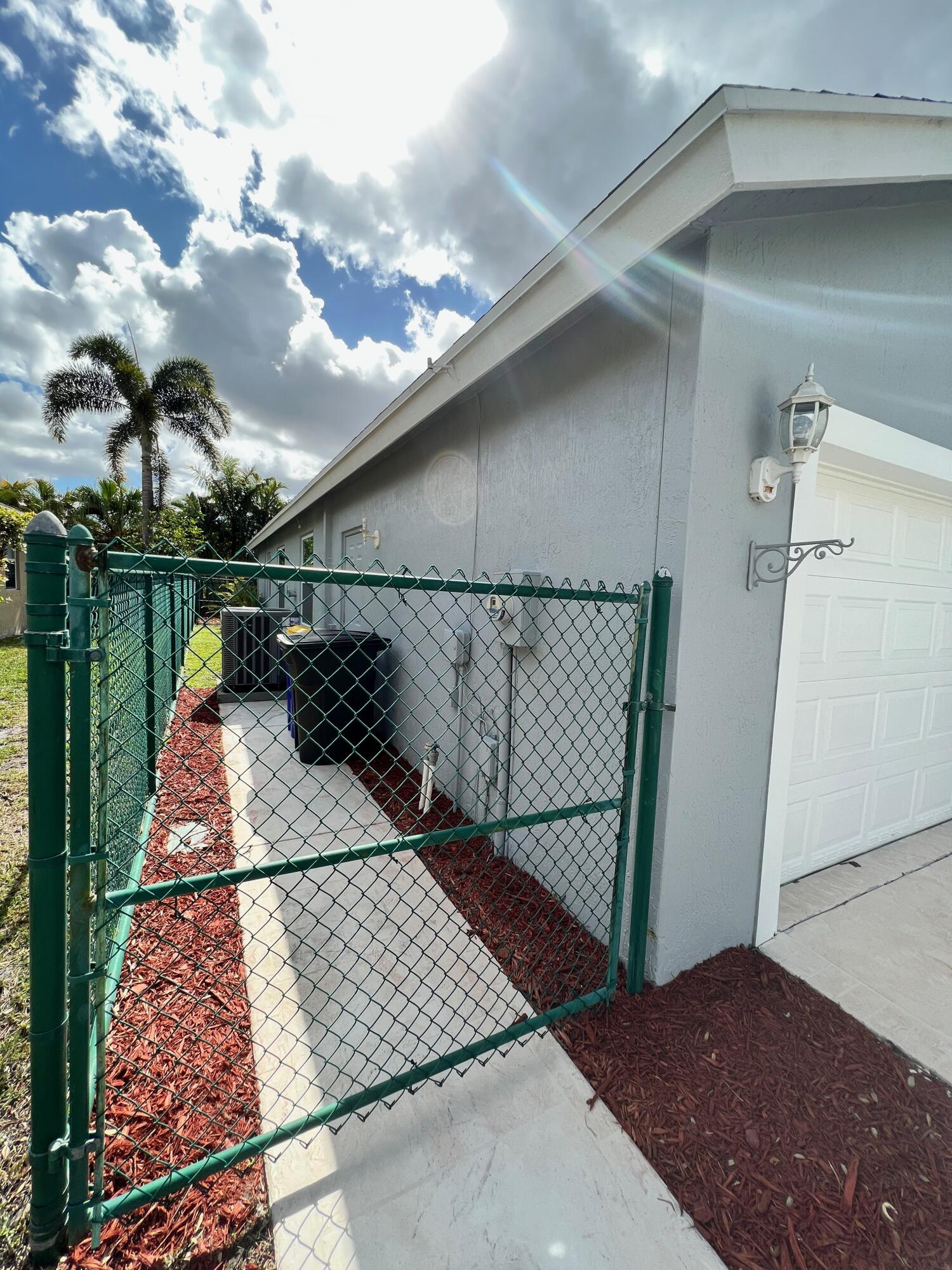 2464 Southwest Omega Way Stuart, FL 34997 - Photo 35 of 70 Fully Fenced yard