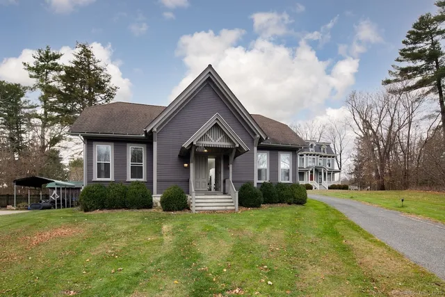 a front view of a house with a yard