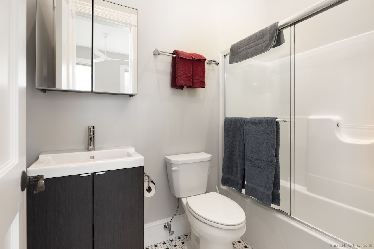 33 Sharon Road Salisbury, CT 06039 - Photo 11 of 13 a bathroom with a toilet a sink and mirror