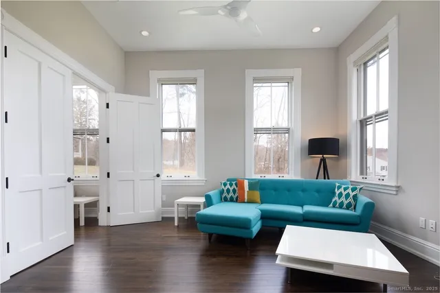 a living room with furniture and a window