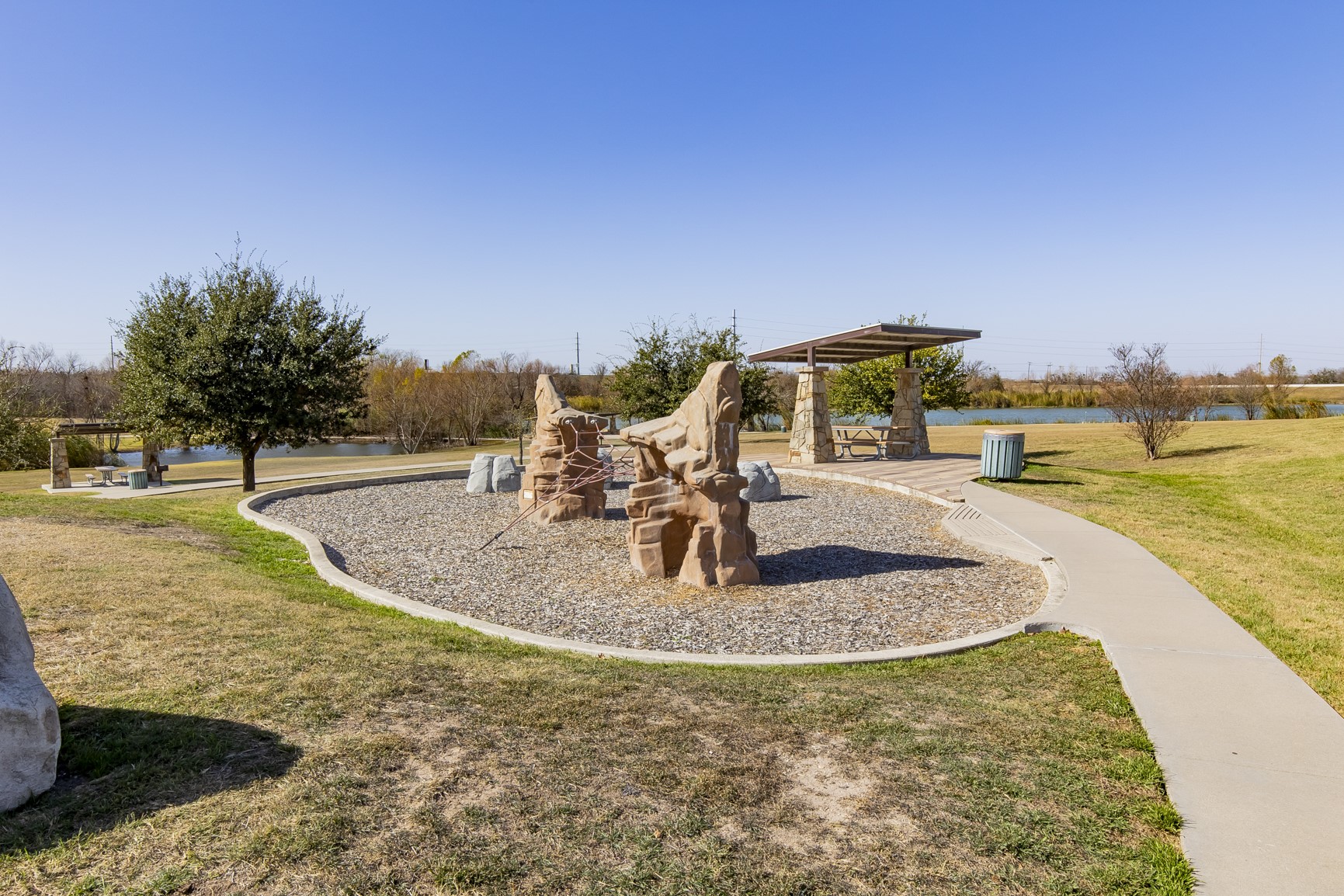 100 Sulphur River Loop Hutto, TX 78634 - Photo 12 of 16 Communal playground featuring a lawn and a patio area