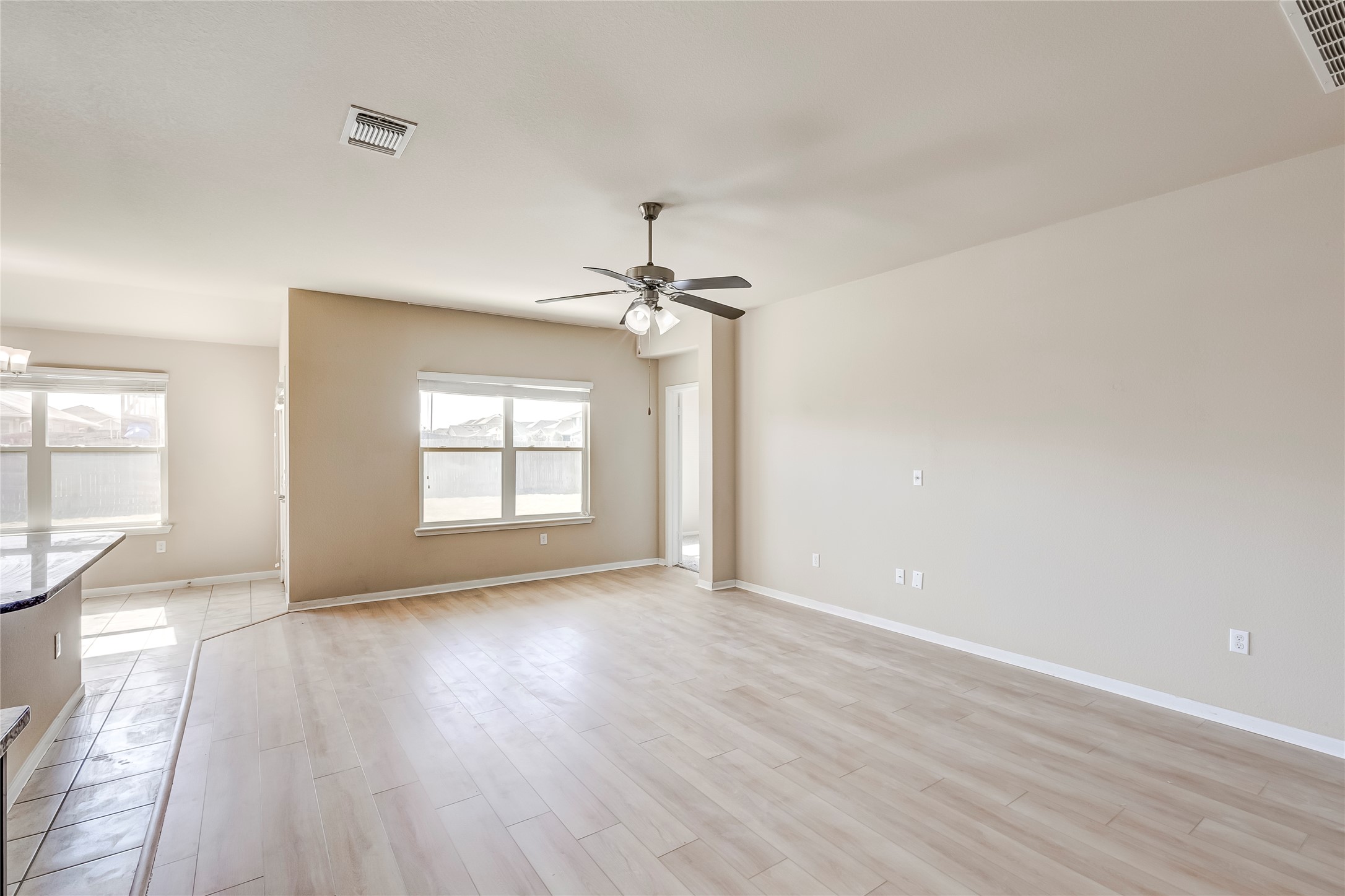 100 Sulphur River Loop Hutto, TX 78634 - Photo 7 of 16 Empty room featuring light wood finished floors and ceiling fan
