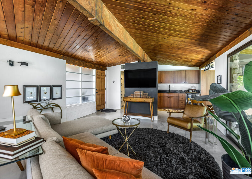 45666 Shadow Mountain Drive Palm Desert, CA 92260 - Photo 14 of 73 a living room with furniture and a flat screen tv