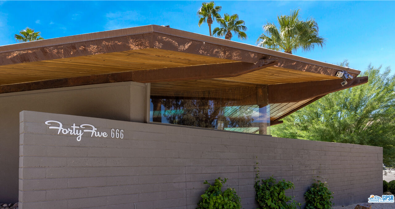 45666 Shadow Mountain Drive Palm Desert, CA 92260 - Photo 3 of 73 a front view of a house with a yard