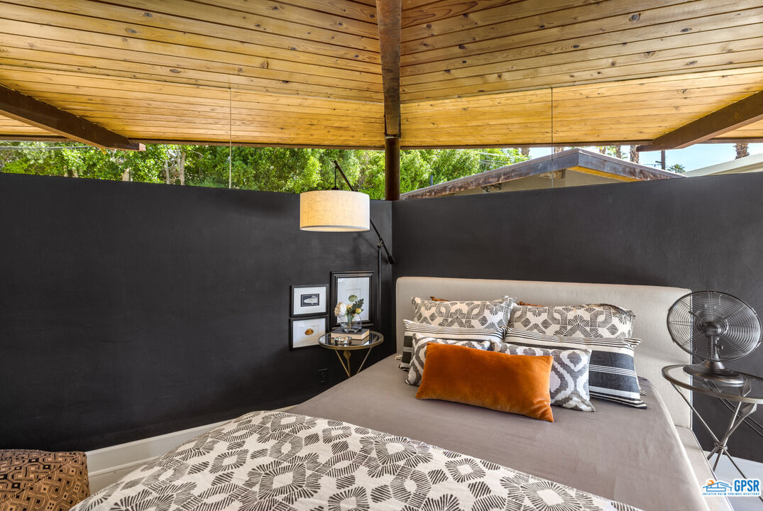 45666 Shadow Mountain Drive Palm Desert, CA 92260 - Photo 32 of 73 a bedroom with a bed and a window