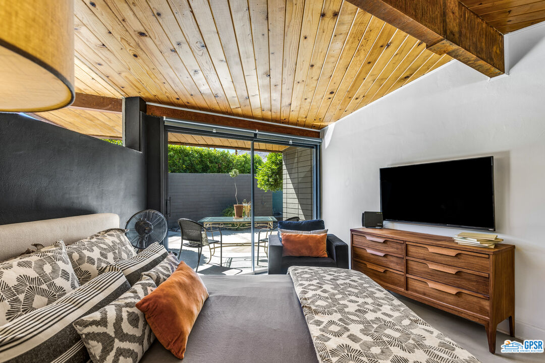 45666 Shadow Mountain Drive Palm Desert, CA 92260 - Photo 33 of 73 a living room with furniture and a flat screen tv