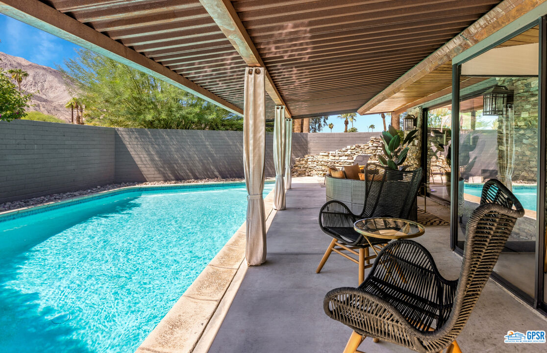 45666 Shadow Mountain Drive Palm Desert, CA 92260 - Photo 35 of 73 a backyard of a house with table and chairs
