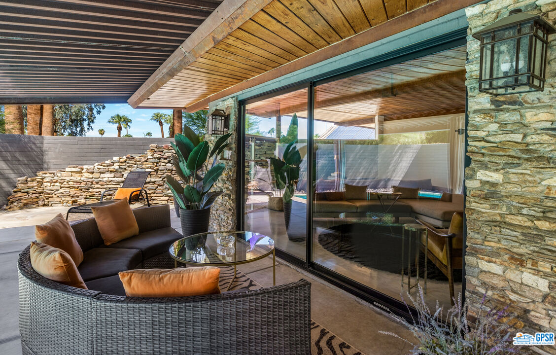 45666 Shadow Mountain Drive Palm Desert, CA 92260 - Photo 36 of 73 a outdoor living space with furniture and a fireplace