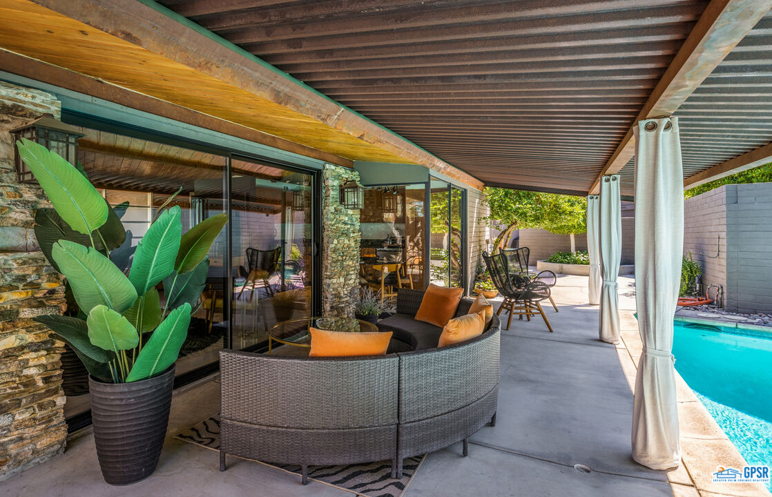 45666 Shadow Mountain Drive Palm Desert, CA 92260 - Photo 37 of 73 a outdoor living space with furniture and a potted plant