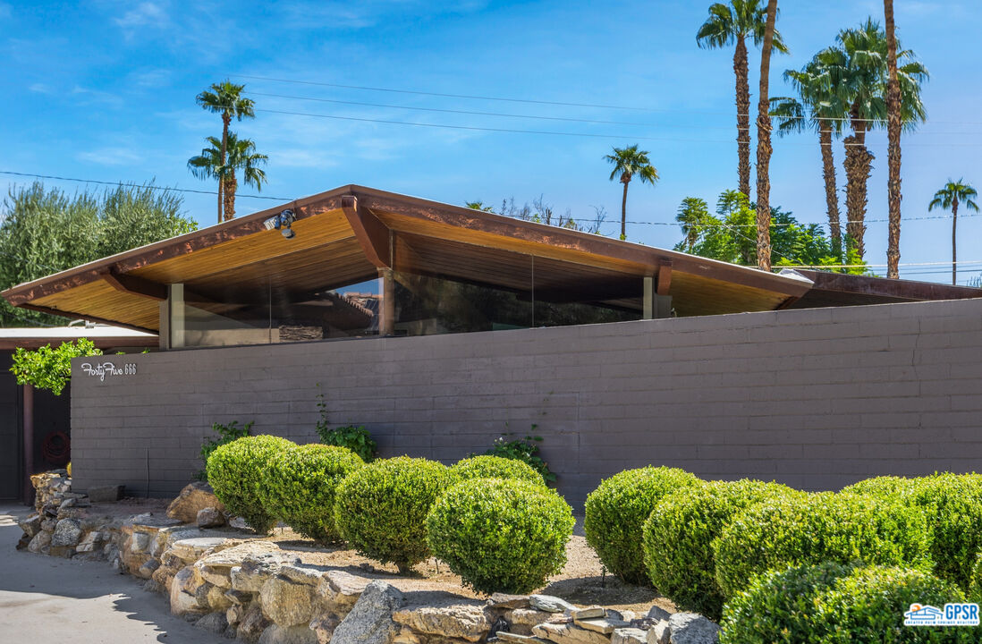 45666 Shadow Mountain Drive Palm Desert, CA 92260 - Photo 4 of 73 a front view of a house with garden