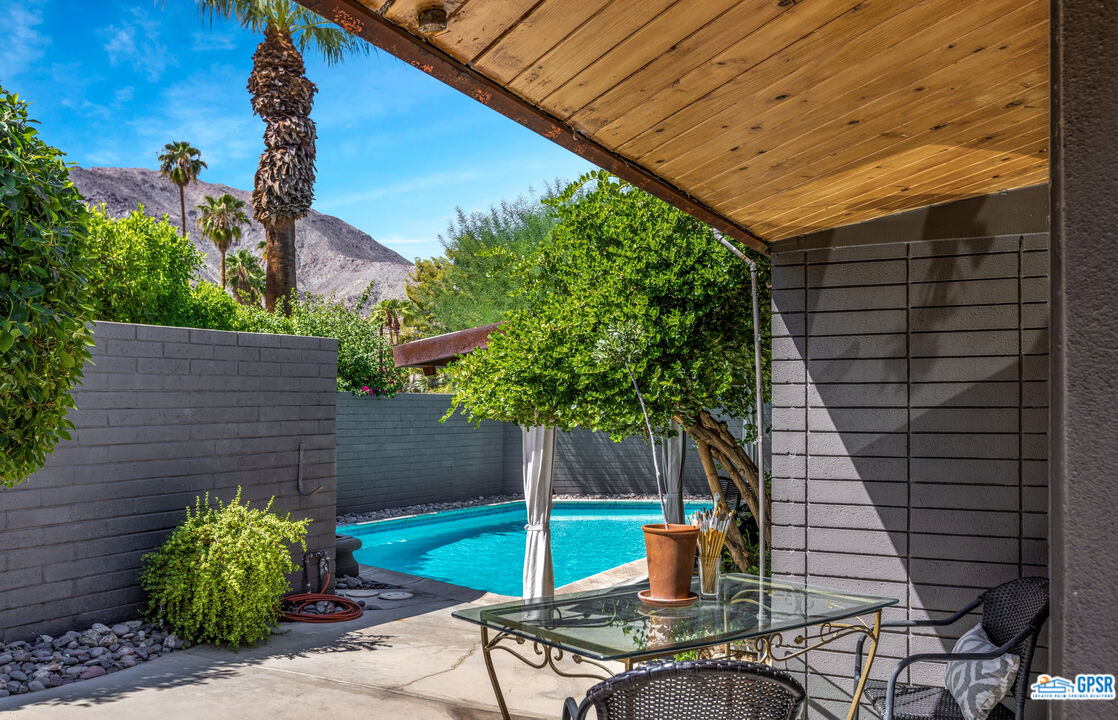 45666 Shadow Mountain Drive Palm Desert, CA 92260 - Photo 42 of 73 a backyard of a house with plants and outdoor seating