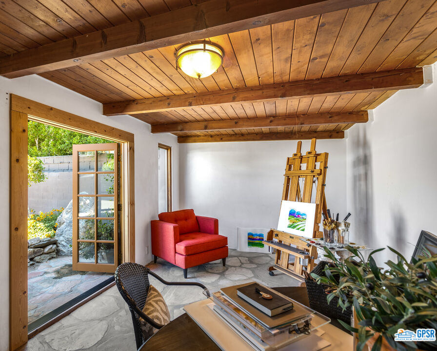 45666 Shadow Mountain Drive Palm Desert, CA 92260 - Photo 52 of 73 a living room with furniture and a window