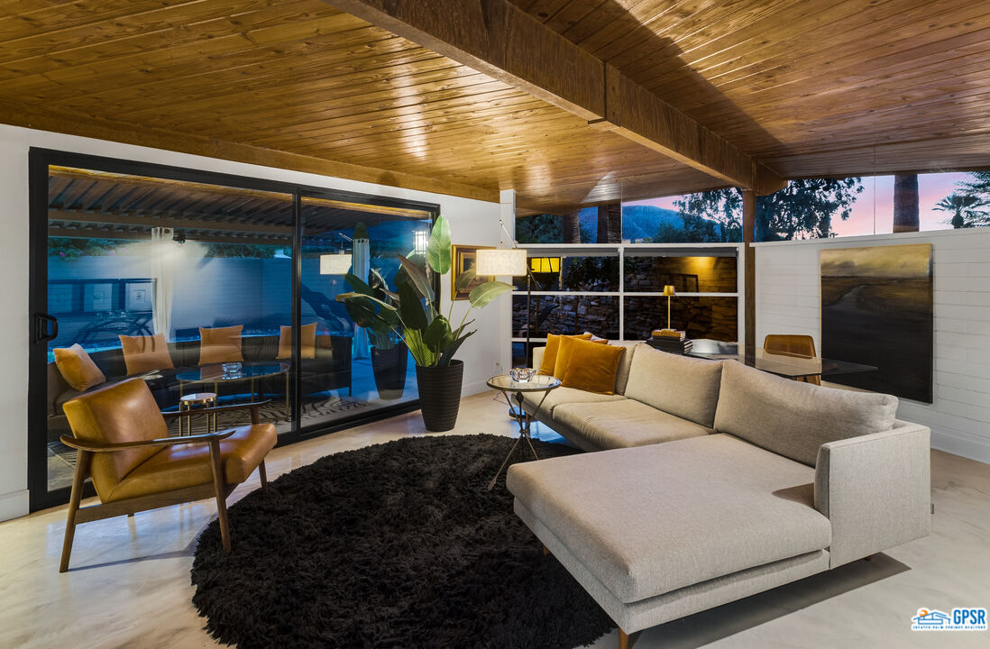 45666 Shadow Mountain Drive Palm Desert, CA 92260 - Photo 62 of 73 a living room with furniture a rug and white walls