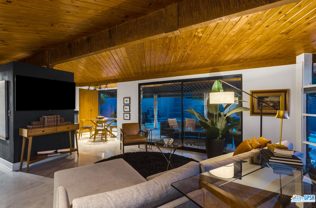 45666 Shadow Mountain Drive Palm Desert, CA 92260 - Photo 64 of 73 a living room with furniture and a flat screen tv