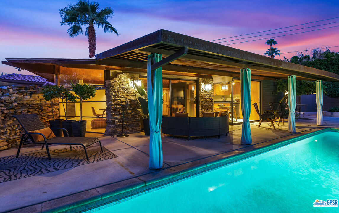 45666 Shadow Mountain Drive Palm Desert, CA 92260 - Photo 65 of 73 a view of a porch with furniture and a yard