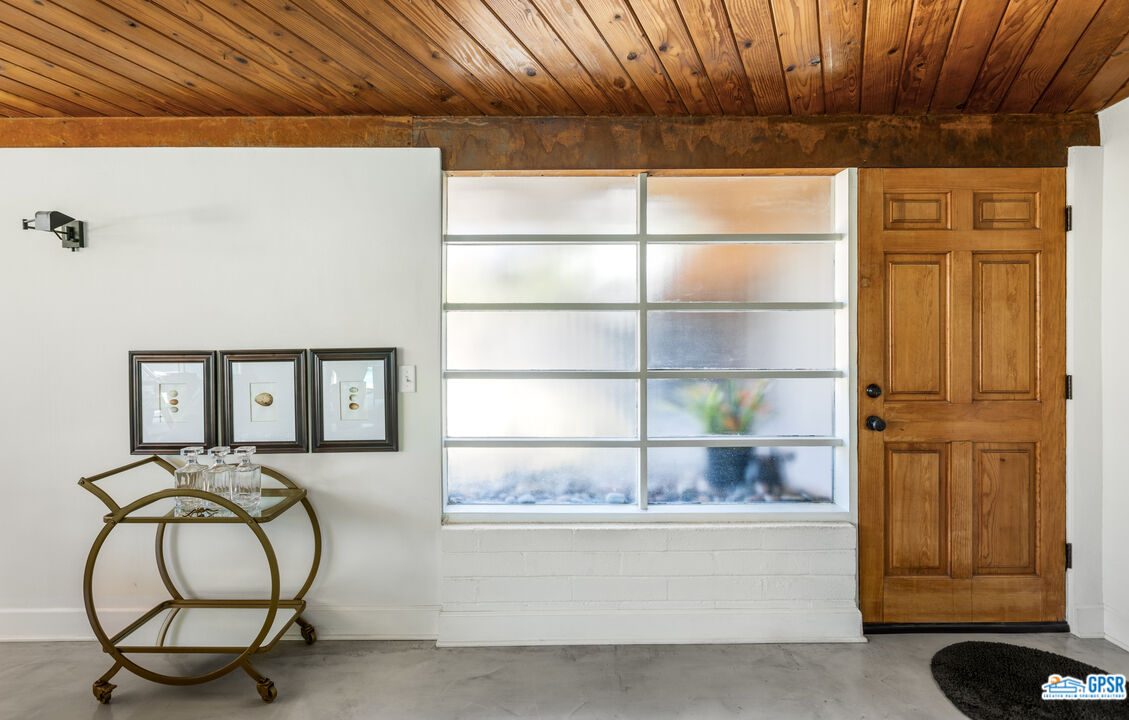 45666 Shadow Mountain Drive Palm Desert, CA 92260 - Photo 8 of 73 a bedroom with a bed and a chandelier