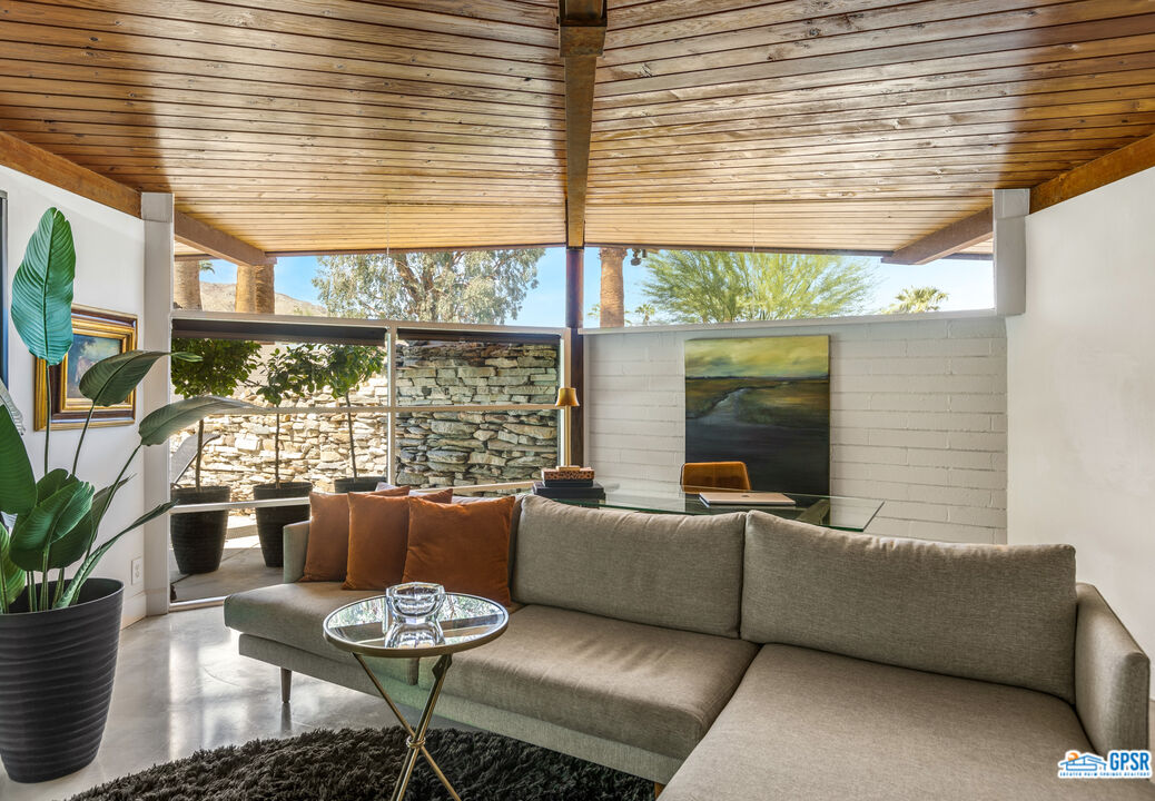 45666 Shadow Mountain Drive Palm Desert, CA 92260 - Photo 10 of 73 a living room with furniture and a large window