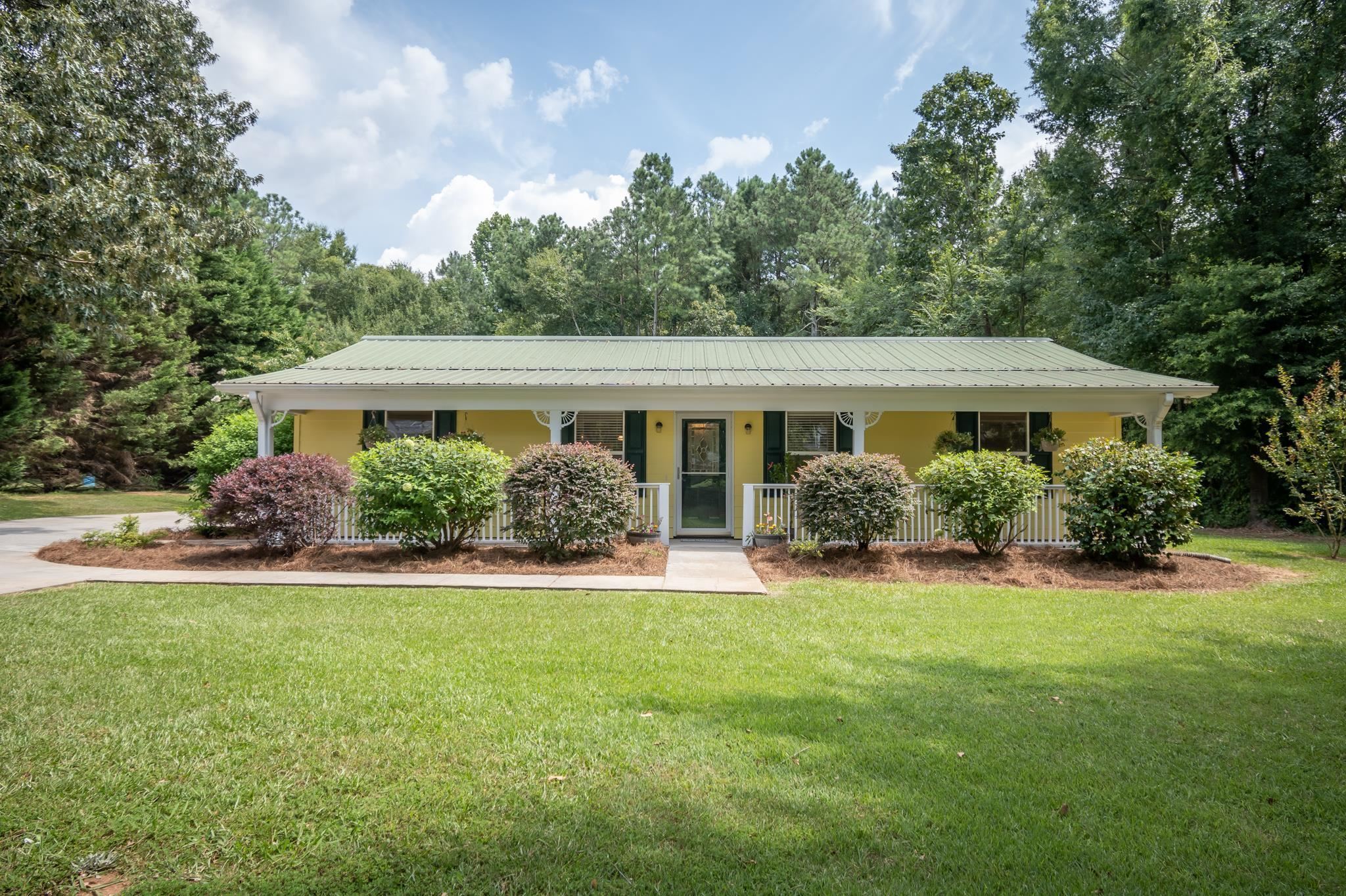 279 Brickyard Road Comer, GA 30629 - Photo 1 of 1 a view of house with garden and yard