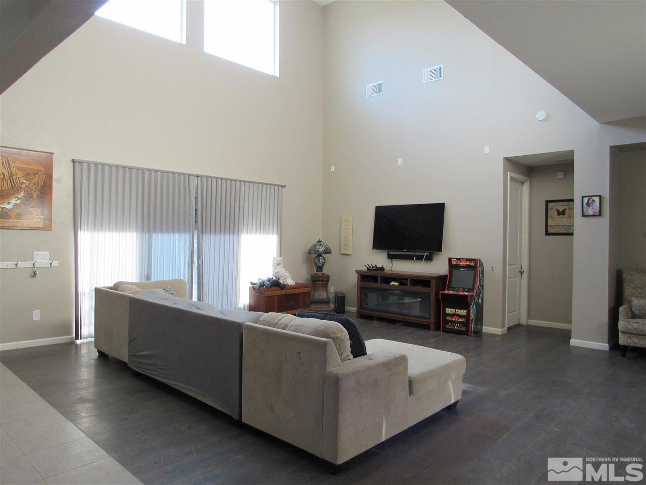 9445 Baldacci Road Reno, NV 89521 - Photo 8 of 8 a living room with furniture and a flat screen tv