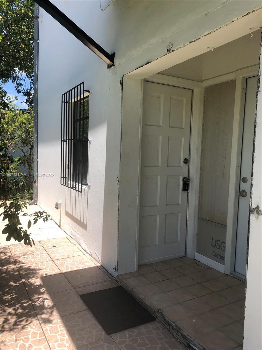 1374 Northeast 176th Street, Unit 3 North Miami Beach, FL 33162 - Photo 2 of 7 a view of a wooden door