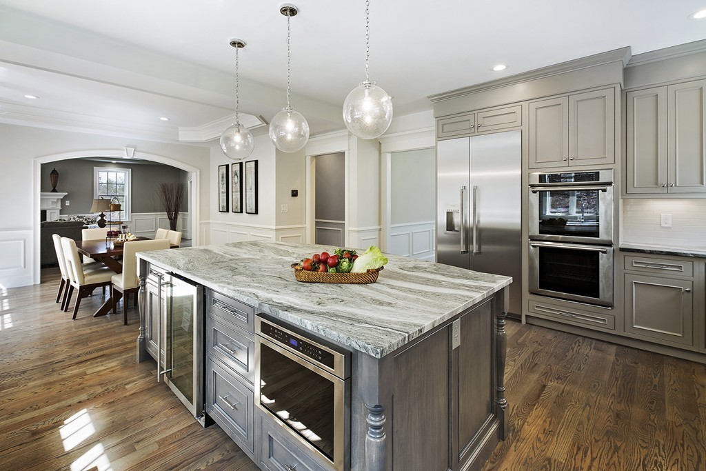 6 Johnson Road Winchester, MA 01890 - Photo 11 of 30 a kitchen with kitchen island a counter space a sink appliances and cabinets