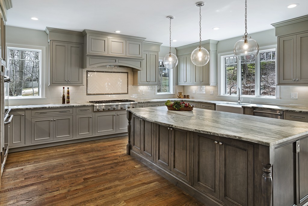 6 Johnson Road Winchester, MA 01890 - Photo 12 of 30 a kitchen with granite countertop a sink appliances cabinets and a large window