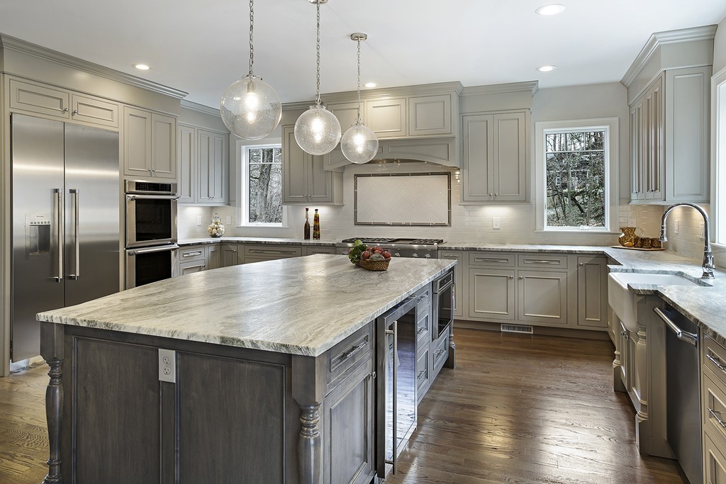 6 Johnson Road Winchester, MA 01890 - Photo 13 of 30 a large kitchen with granite countertop a sink a counter space appliances and cabinets