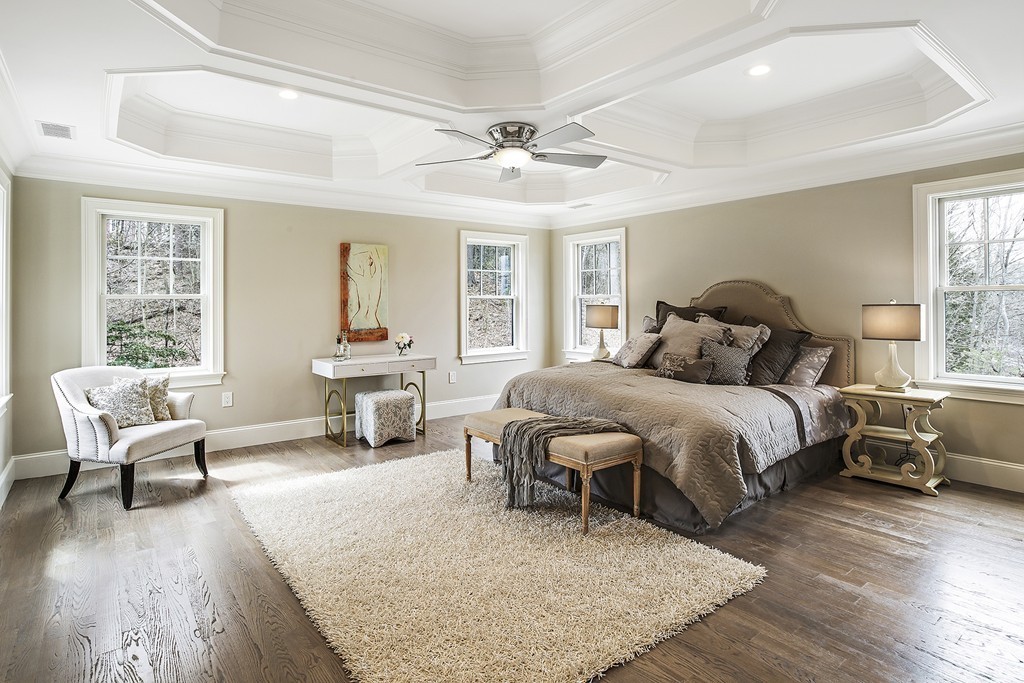 6 Johnson Road Winchester, MA 01890 - Photo 17 of 30 a spacious bedroom with a bed a couch and large windows