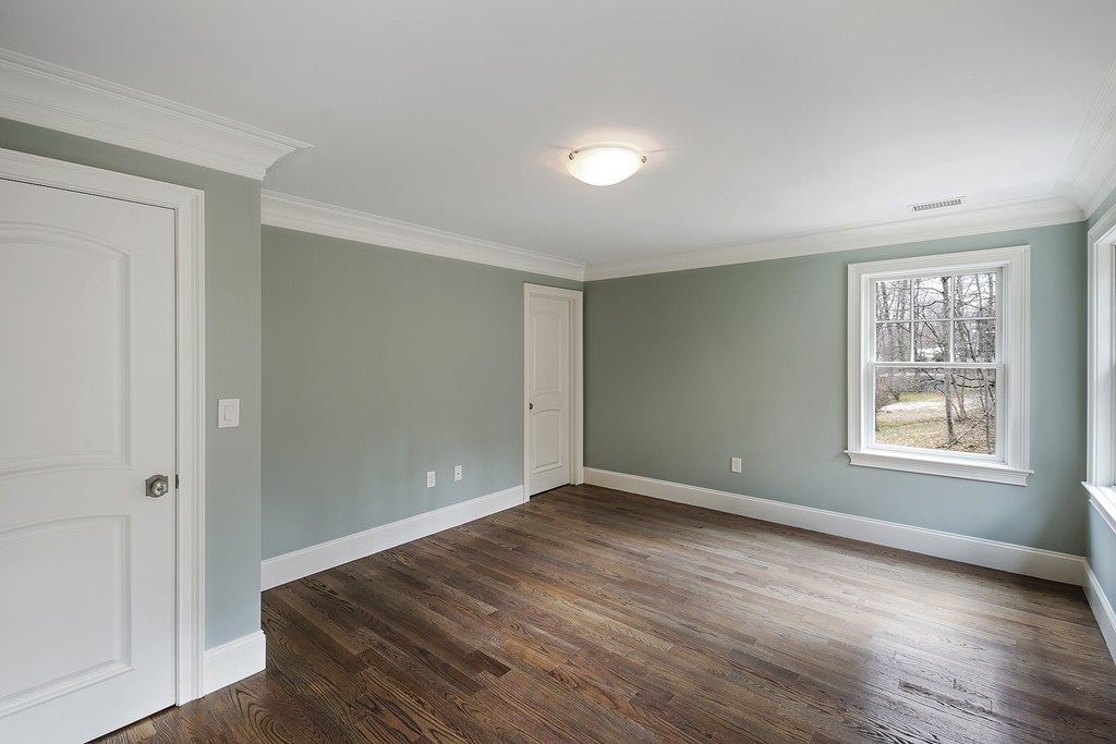 6 Johnson Road Winchester, MA 01890 - Photo 21 of 30 a view of an empty room with wooden floor and a window