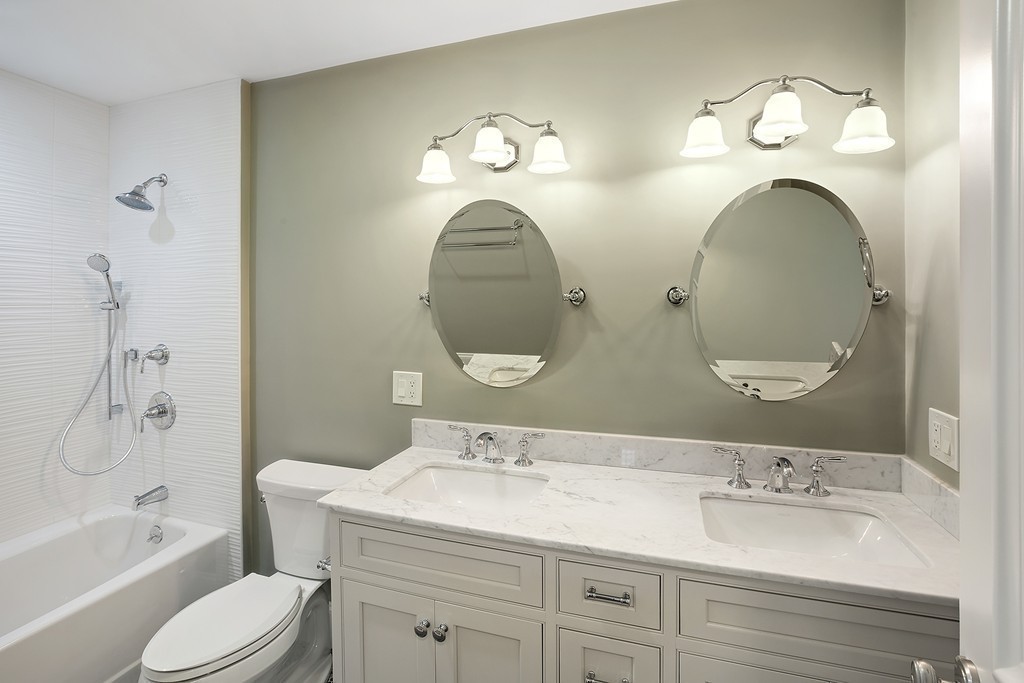 6 Johnson Road Winchester, MA 01890 - Photo 22 of 30 a bathroom with a double vanity sink and a mirror