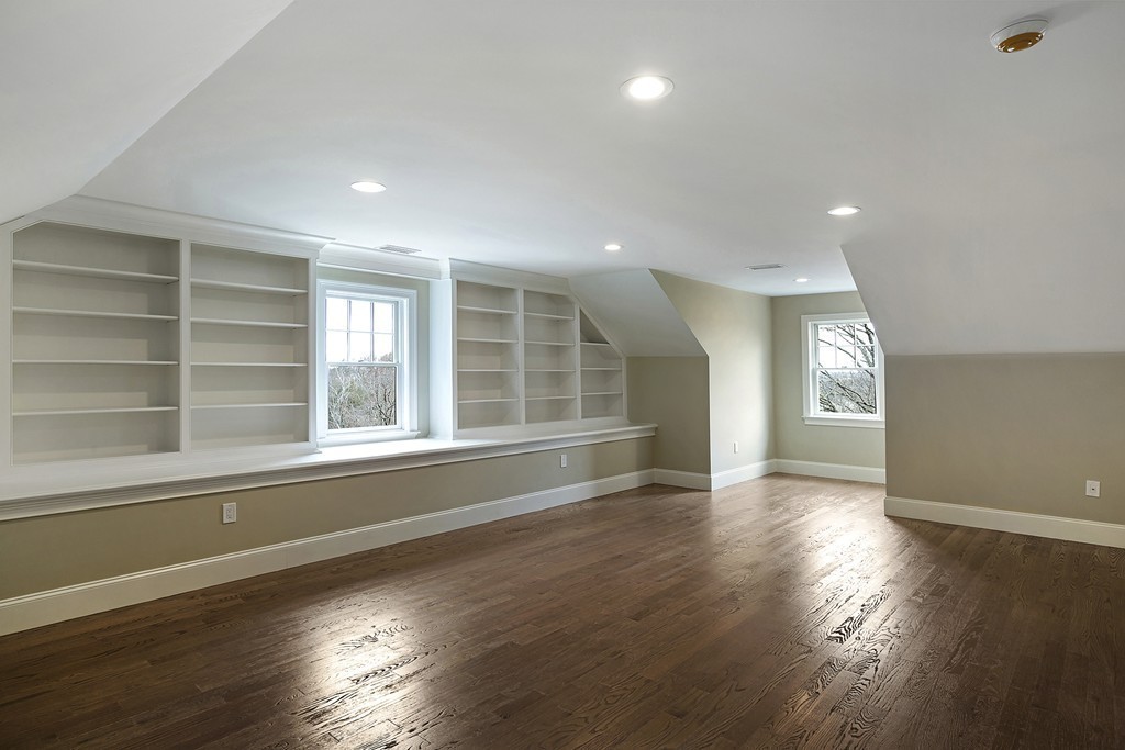 6 Johnson Road Winchester, MA 01890 - Photo 24 of 30 a view of an empty room with wooden floor and a window