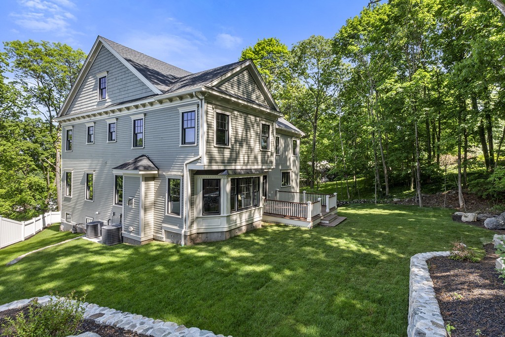 6 Johnson Road Winchester, MA 01890 - Photo 27 of 30 a front view of a house with a garden