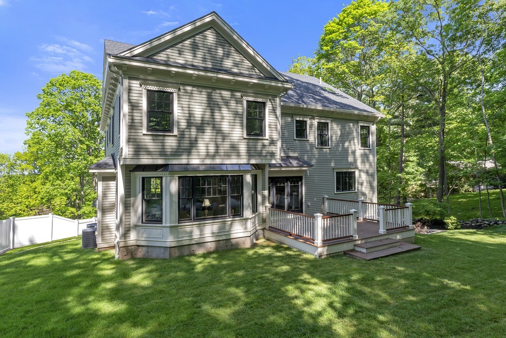 6 Johnson Road Winchester, MA 01890 - Photo 28 of 30 a front view of a house with a garden
