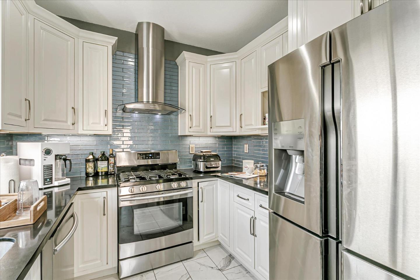3657 Jasmine Circle San Jose, CA 95135 - Photo 12 of 62 a kitchen with stainless steel appliances granite countertop a refrigerator sink and stove