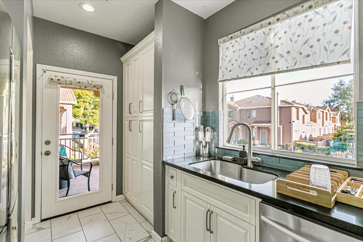 3657 Jasmine Circle San Jose, CA 95135 - Photo 13 of 62 a kitchen with stainless steel appliances granite countertop a sink and a window