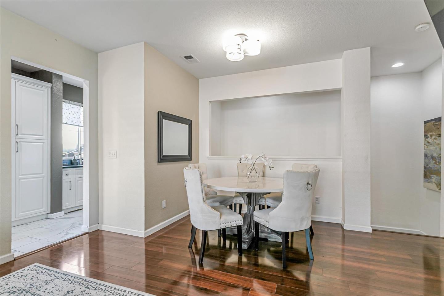 3657 Jasmine Circle San Jose, CA 95135 - Photo 17 of 62 a view of a dining room with furniture and wooden floor