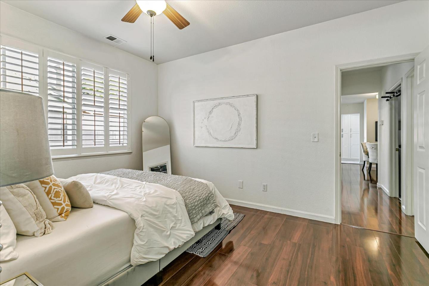 3657 Jasmine Circle San Jose, CA 95135 - Photo 21 of 62 a bedroom with a bed wooden floor and window